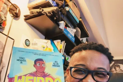Me with Tony Weaver Jr's book, "Weirdo"